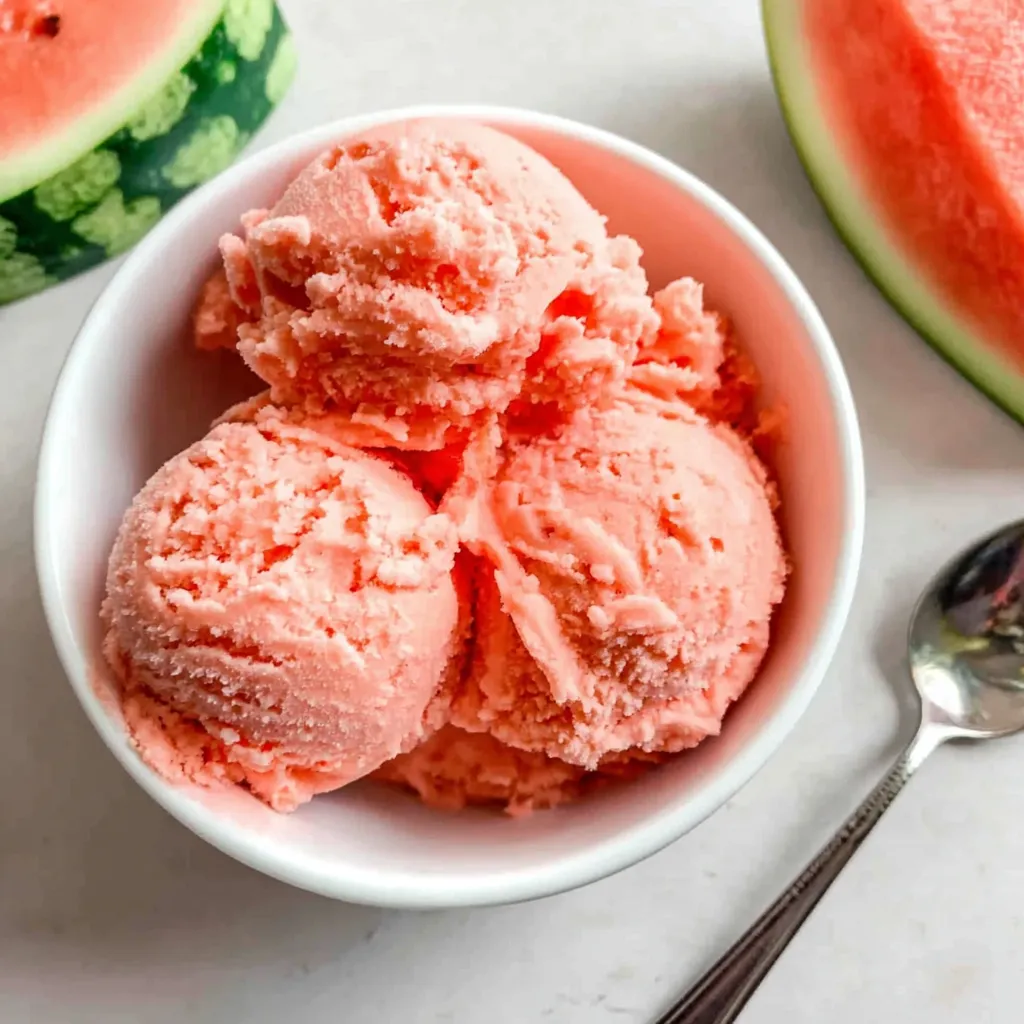 Fresh watermelon ice cream scoops on ice. Cool, tasty summer treat.