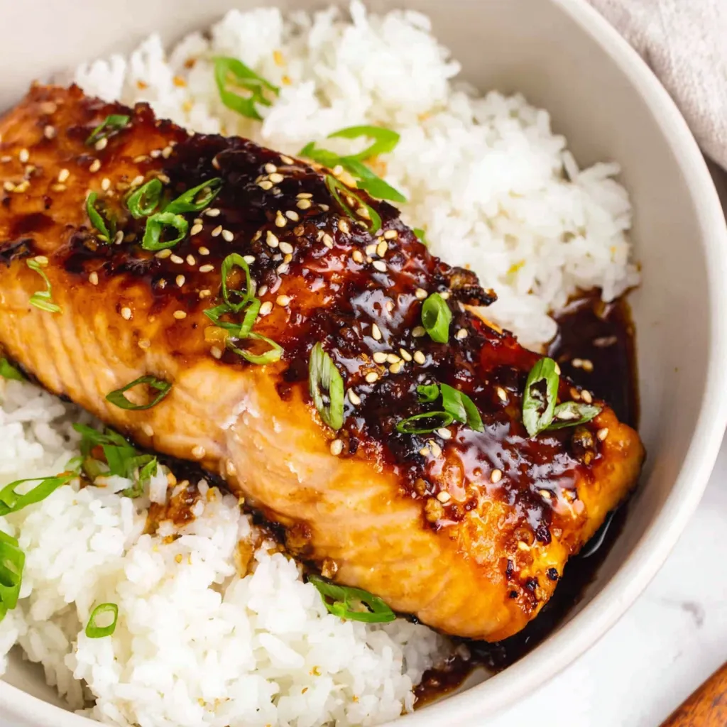 Close-up of teriyaki salmon in air fryer basket. Easy air fryer salmon recipe.