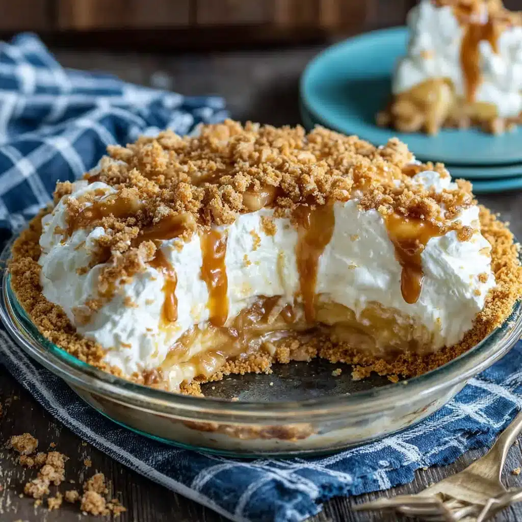 Irresistible Caramel Apple Cheesecake Dip close up showcasing its creamy texture and appealing apple slices.