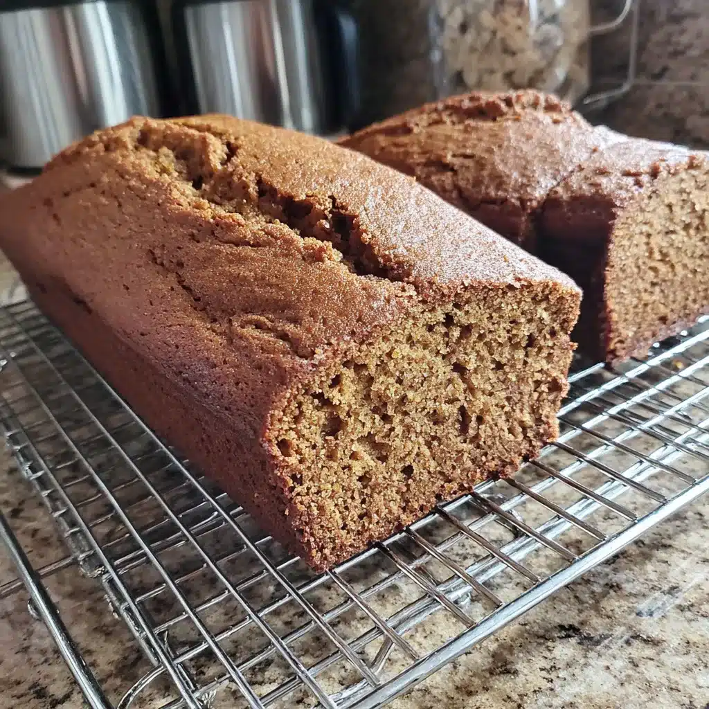 Close-up of perfectly moist and spiced pumpkin bread showcasing its irresistible texture and inviting color.