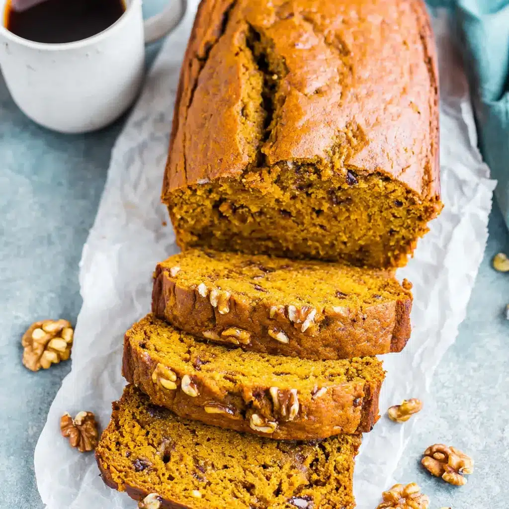 Close-up shot showcasing the moist texture and delicious pumpkin spice swirl of the homemade banana bread.