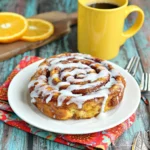 Irresistible cinnamon roll French toast stacked high shows a wow-worthy breakfast perfect for a special occasion.