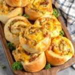 Close-up of golden brown, soft, and fluffy buttery breakfast rolls, showcasing their irresistible texture and inviting aroma.