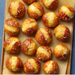 Homemade soft pretzel bites, freshly baked and ready to enjoy, a delicious and addictive snack.
