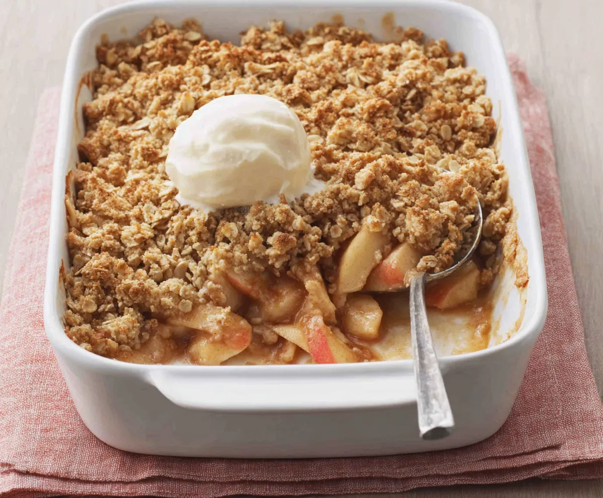 Homemade Apple Crisp Recipe Close-up shows a freshly baked Apple Crisp with a golden brown topping.