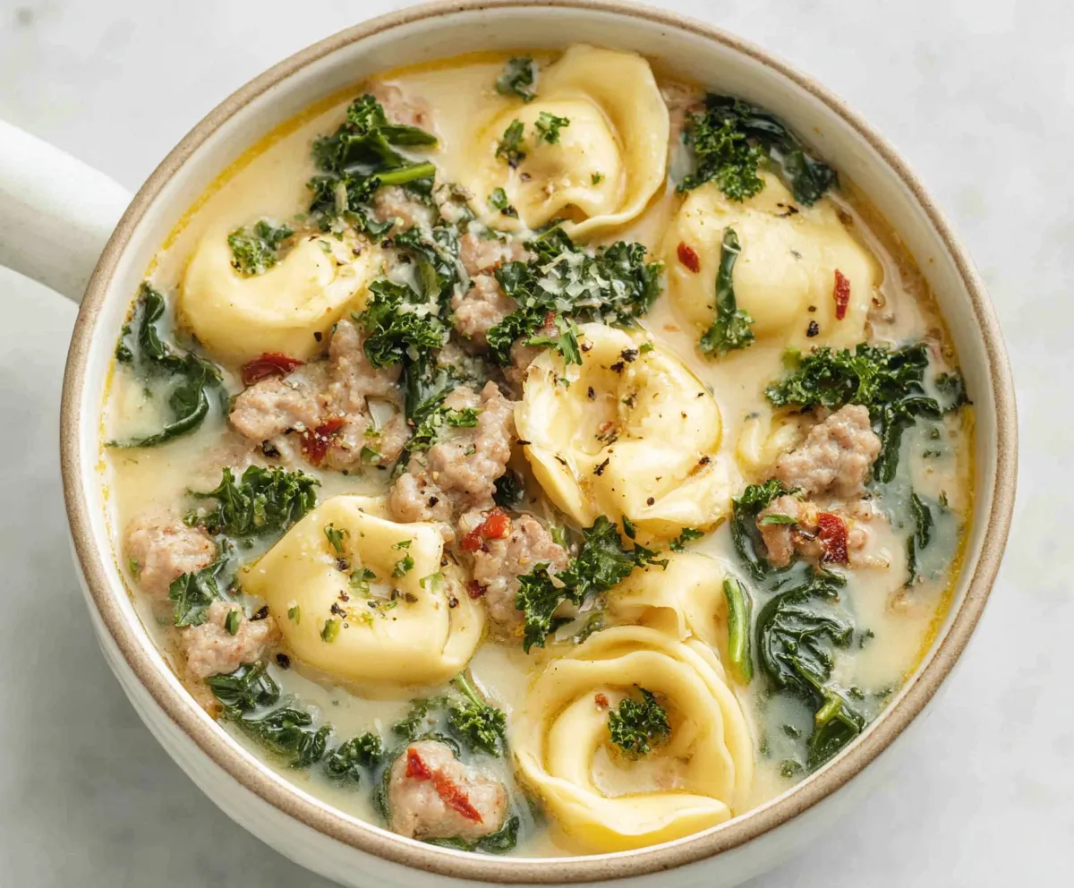 Autumn Tortellini Soup with Sausage A bowl of Autumn Tortellini Soup With Sausage is shown as a second example of the finished recipe.
