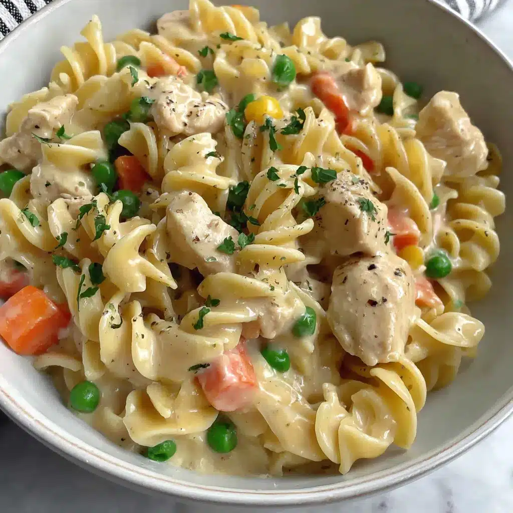 Chicken pot pie pasta, a creamy and comforting dish, is featured in this recipe image.