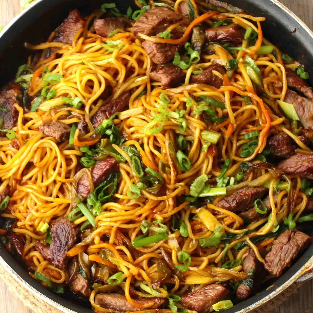 Sticky Beef Noodles Closeup Close-up shot showcasing the delicious texture and ingredients of Sticky Beef Noodles.