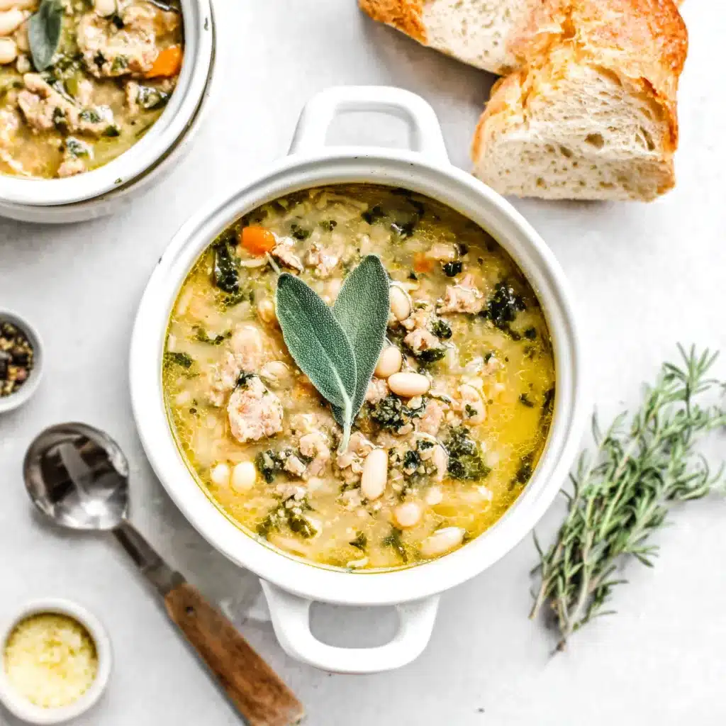 Tuscan White Bean Soup Bowl Close-up of a hearty bowl of Tuscan White Bean Soup, showcasing the creamy broth and tender beans.