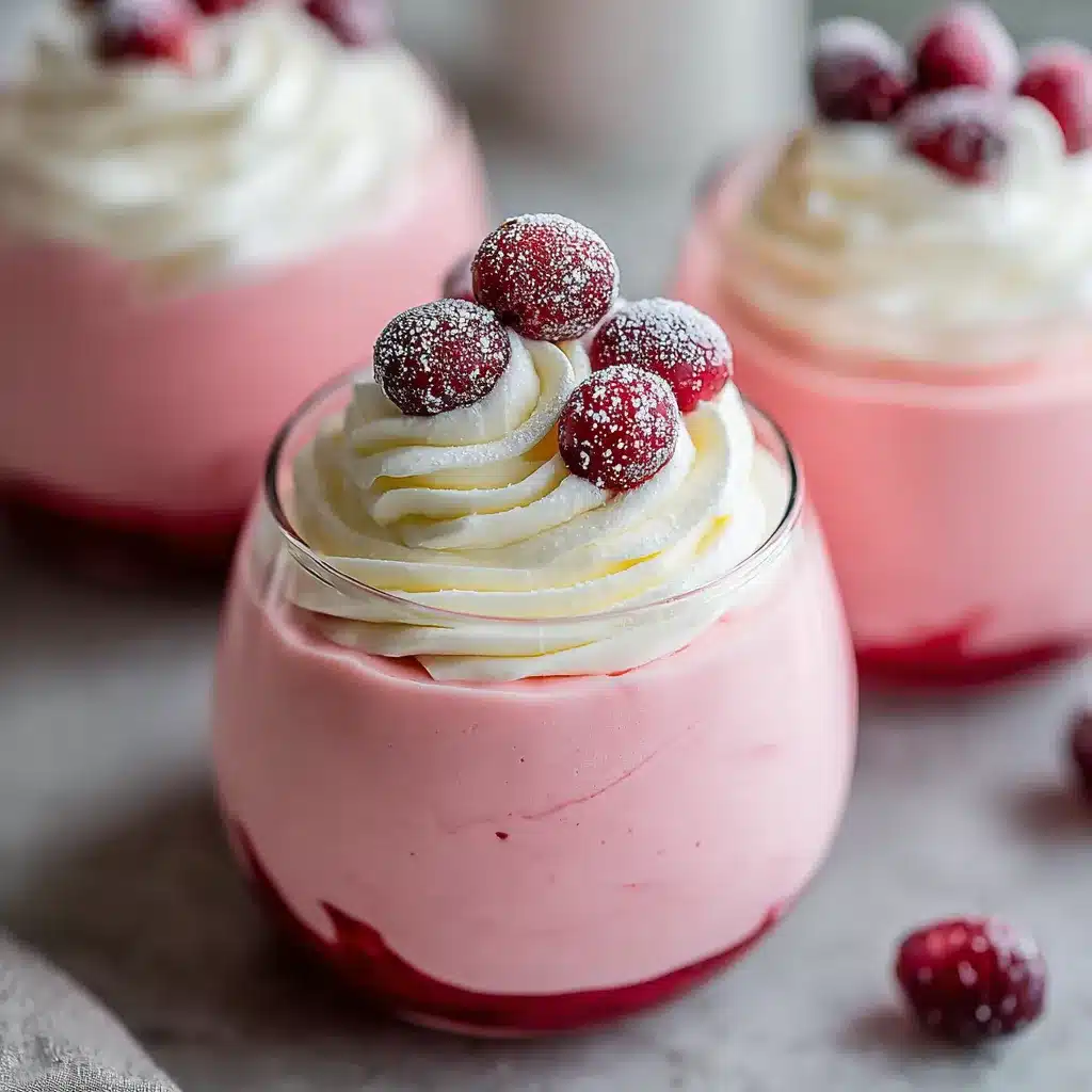 Cranberry Mousse Cups Recipe Close-up of festive Cranberry Mousse Cups ready to be served, showcasing their creamy texture and cranberry topping.